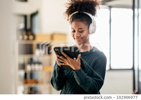 African american student woman wearing sweater and headphones to African american student woman wearing sweater and headphones to 102906977
