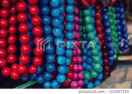 Wooden red beads on the market 102907183
