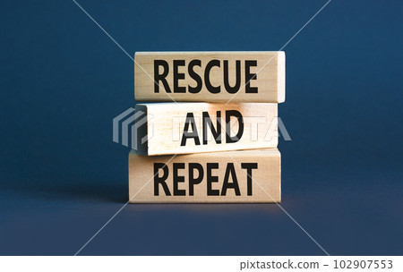Rescue and repeat symbol. Concept words Rescue and repeat on wooden block on a beautiful grey table grey background. Business rescue and repeat concept. Copy space. 102907553