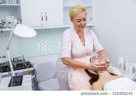 lifting procedure, Face massage, Facial treatment, Skin scrubbing,Skin cleansing at the beautician's lifting procedure, Face massage, Facial treatment, Skin scrubbing,Skin cleansing at the beautician's 102908245