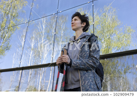 Pole Walking In Urban Area, City Beautiful Happy Caucasian Woman Training With Sticks Outdoor, Modern Glass Eco Building on Background. Physical Activity, Nordic Walk, Recreation.Horizontal,CopySpace Pole Walking In Urban Area, City Beautiful Happy Caucasian Woman Training With Sticks Outdoor, Modern Glass Eco Building on Background. Physical Activity, Nordic Walk, Recreation.Horizontal,CopySpace 102909479