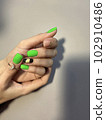 Amazing natural nails. Women's hands with clean manicure 102910486