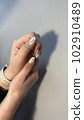 Closeup photo of a beautiful female hands 102910489