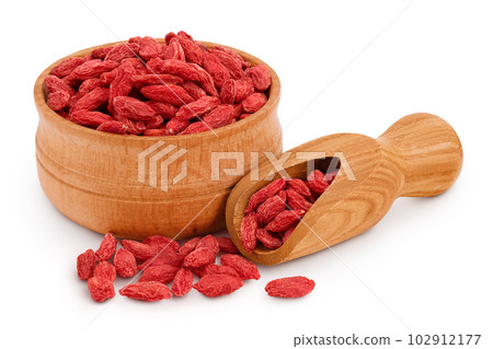 Dried goji berries in wooden bowl and scoop isolated on white background Dried goji berries in wooden bowl and scoop isolated on white background 102912177