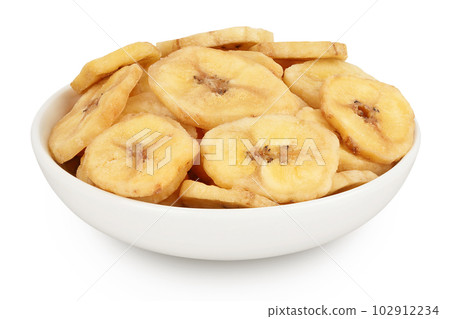 Dried banana chips in ceramic bowl isolated on white background with full depth of field 102912234