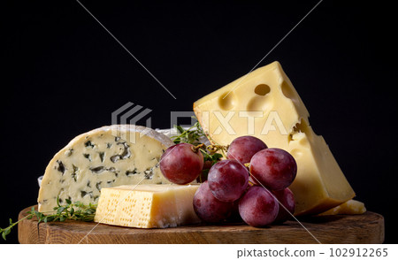 still life with various cheese and grape 102912265