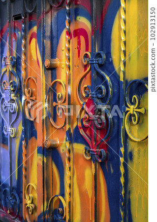 The door of the house smeared with the colors. 102913150