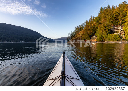 Kayaking in Indian Arm near Belcarra, Vancouver, BC, Canada. Kayaking in Indian Arm near Belcarra, Vancouver, BC, Canada. 102920887