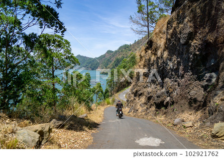 A person who guides you to Trunyan village and a steep journey A person who guides you to Trunyan village and a steep journey 102921762