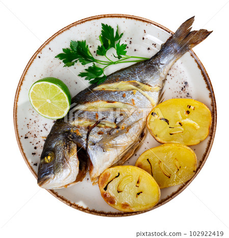 Dorado and potatoes baked in oven Dorado and potatoes baked in oven 102922419