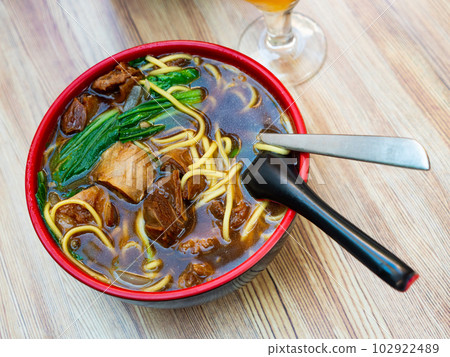Noodle soup ramen with beef, mushrooms and greens Noodle soup ramen with beef, mushrooms and greens 102922489