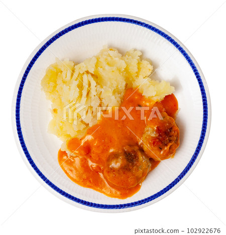 Meatballs in sauce served with mashed potatoes Meatballs in sauce served with mashed potatoes 102922676