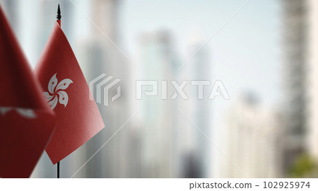 Small flags of the Hong Kong on an abstract blurry background Small flags of the Hong Kong on an abstract blurry background 102925974
