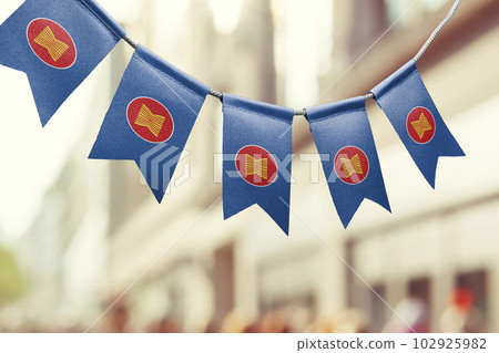 A garland of ASEAN national flags on an abstract blurred background 102925982