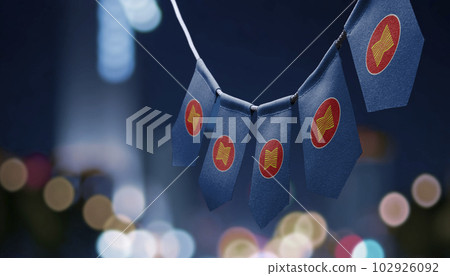 A garland of ASEAN national flags on an abstract blurred background 102926092