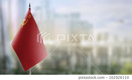 Small flags of the USSR on an abstract blurry background Small flags of the USSR on an abstract blurry background 102926110