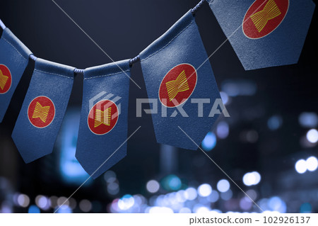 A garland of ASEAN national flags on an abstract blurred background 102926137