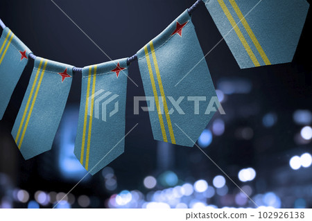 A garland of Aruba national flags on an abstract blurred background 102926138