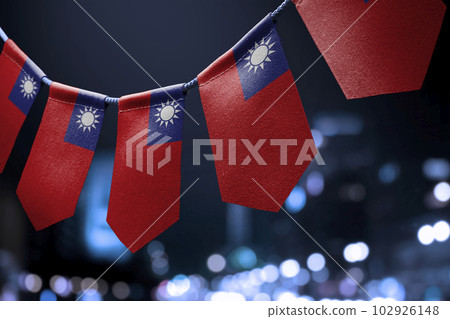 A garland of Taiwan national flags on an abstract blurred background 102926148