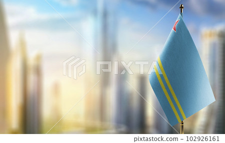 Small flags of the Aruba on an abstract blurry background 102926161