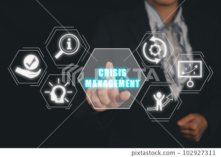 Crisis management concept, Business person hand touching crisis management icon on virtual screen. Crisis management concept, Business person hand touching crisis management icon on virtual screen. 102927311