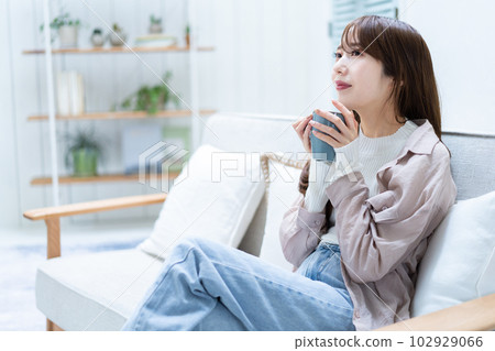 A woman with a mug A woman with a mug 102929066