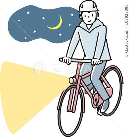 Young man riding a bicycle with lights on at night 102929090