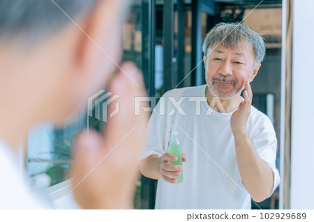Middle-aged men taking care of their skin Middle-aged men taking care of their skin 102929689