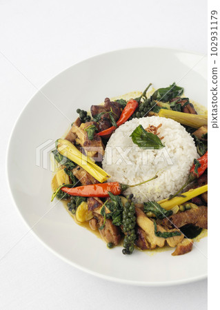 Pad Krapow Gai spicy Thai Chicken Vegetable Stir Fry on white plate 102931179
