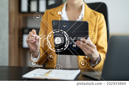 Copyright or patent concept, Person hand using laptop computer, tablet and smartphone with virtual screen copyright icon trademark, Creation ownership against piracy at office. 102933664