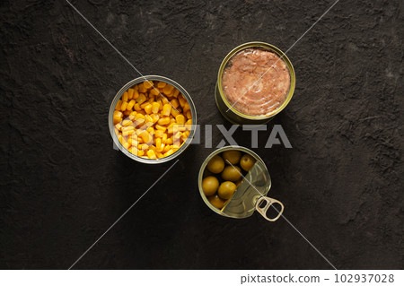 Canned food in blank metal jars, concept of canned food Canned food in blank metal jars, concept of canned food 102937028