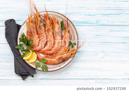 Fresh seafood. Plate with langoustines Fresh seafood. Plate with langoustines 102937298