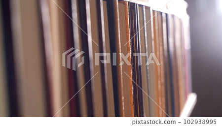 Many books organized in shelves in a big bookstore 102938995