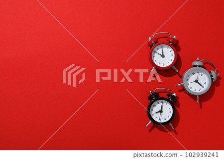 Concept of sleep and wake up with alarm clocks Concept of sleep and wake up with alarm clocks 102939241