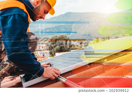 Workers assemble energy system with solar panel for electricity and hot water Workers assemble energy system with solar panel for electricity and hot water 102939912