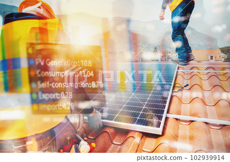 Workers assemble energy system with solar panel for electricity and hot water Workers assemble energy system with solar panel for electricity and hot water 102939914