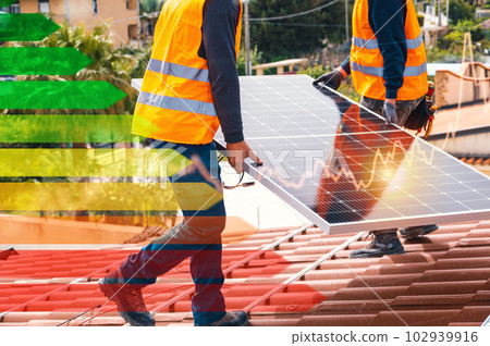 Workers assemble energy system with solar panel for electricity and hot water 102939916