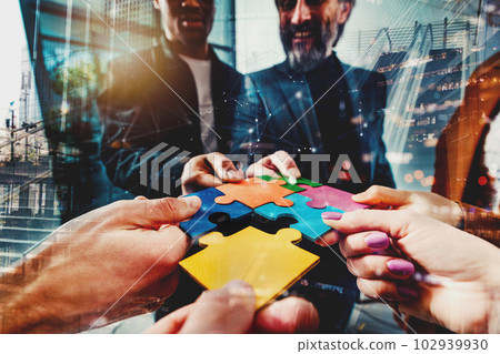 Teamwork of partners connect puzzle pieces as integration and startup Teamwork of partners connect puzzle pieces as integration and startup 102939930