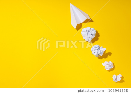 Business, startup and sponsorship concept with paper plane on yellow background Business, startup and sponsorship concept with paper plane on yellow background 102941558