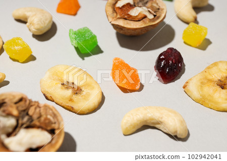 Tasty food concept - delicious dried fruits, tasty dried food Tasty food concept - delicious dried fruits, tasty dried food 102942041