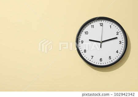 Concept of time change with clock on beige background 102942342
