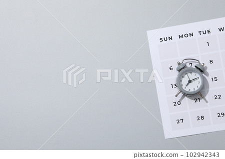 Concept of time management with alarm clock 102942343