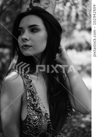 Portrait of an young beautiful sexy woman on the nature Portrait of an young beautiful sexy woman on the nature 102942604