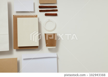 Mockup flat lay with different office accessories on white background Mockup flat lay with different office accessories on white background 102943388