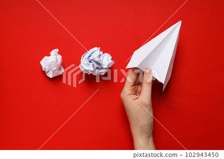 Business, startup and sponsorship concept with paper plane on red background Business, startup and sponsorship concept with paper plane on red background 102943450