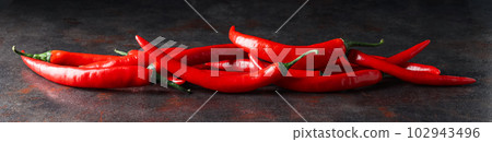 Concept of hot and spicy ingredients - red hot chili pepper 102943496