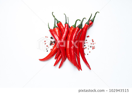 Concept of hot and spicy ingredients - red hot chili pepper Concept of hot and spicy ingredients - red hot chili pepper 102943515