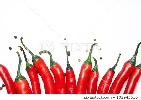 Concept of hot and spicy ingredients - red hot chili pepper Concept of hot and spicy ingredients - red hot chili pepper 102943516