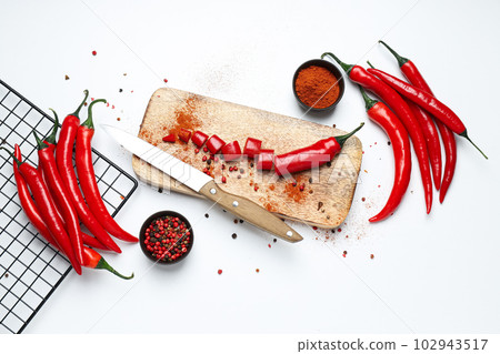 Concept of hot and spicy ingredients - red hot chili pepper Concept of hot and spicy ingredients - red hot chili pepper 102943517