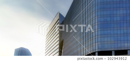 Modern glass office building. Exterior office glass building. Modern architecture. Company glass window. Corporate business building. Financial business center tower. Safety glass building material. Modern glass office building. Exterior office glass building. Modern architecture. Company glass window. Corporate business building. Financial business center tower. Safety glass building material. 102943912